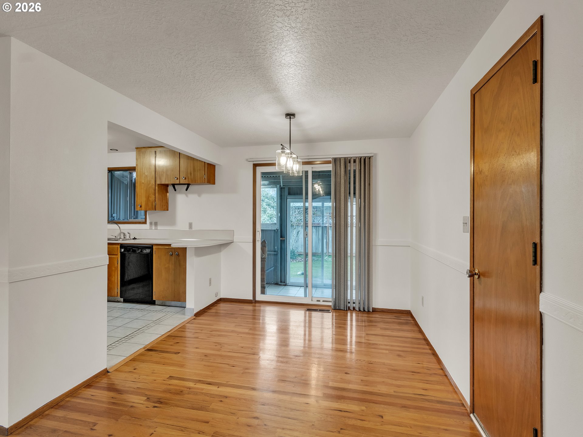 1749 Thompson Road Woodburn, OR 97071 - Photo 12 of 33 a view of a kitchen with a sink and a window