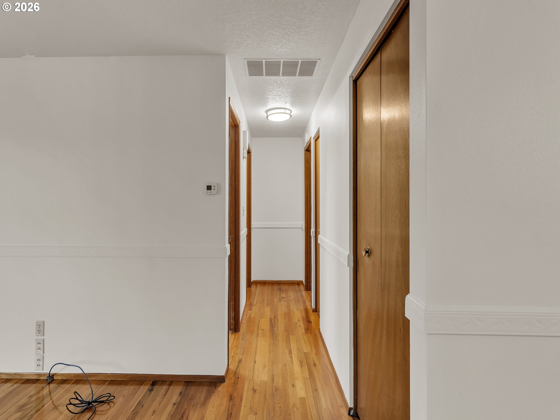 1749 Thompson Road Woodburn, OR 97071 - Photo 20 of 33 a view of hallway with wooden floor