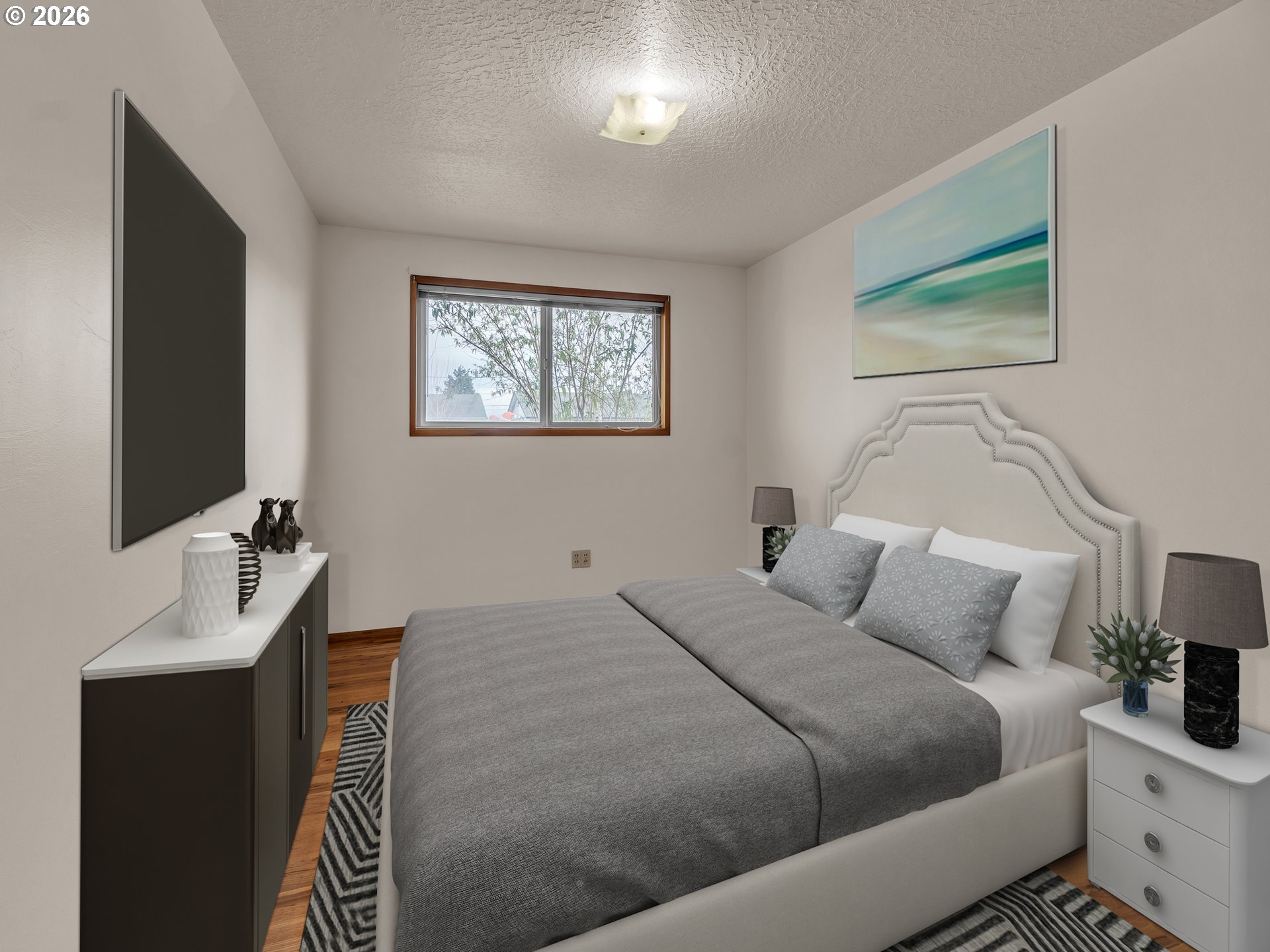 1749 Thompson Road Woodburn, OR 97071 - Photo 23 of 33 a bedroom with a bed and a flat screen tv