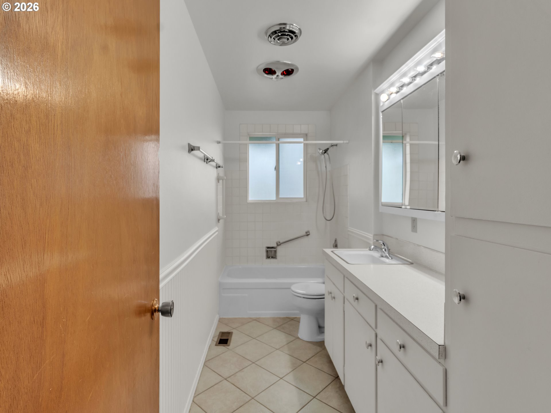 1749 Thompson Road Woodburn, OR 97071 - Photo 26 of 33 a bathroom with a double vanity sink toilet mirror and bathtub