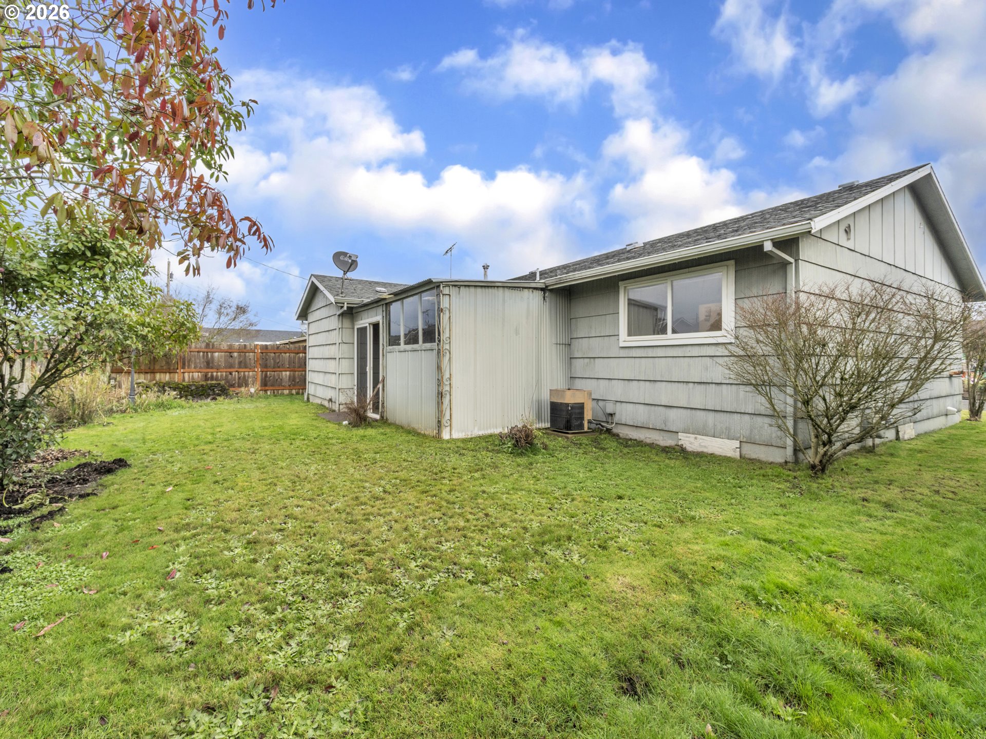 1749 Thompson Road Woodburn, OR 97071 - Photo 33 of 33 a backyard of a house with plants and tree