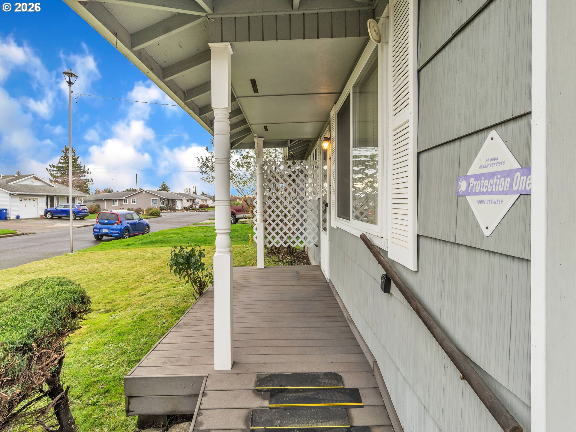 1749 Thompson Road Woodburn, OR 97071 - Photo 8 of 33 a view of a porch with wooden floor and bench