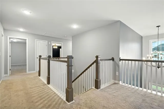 an aerial view of residential houses with outdoor space and swimming pool