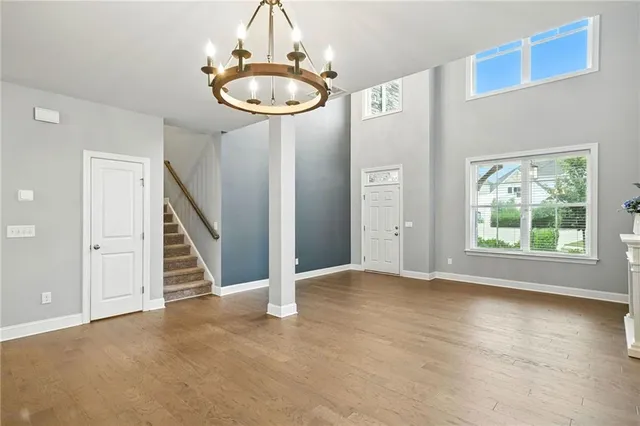 a living room with furniture fireplace and large windows