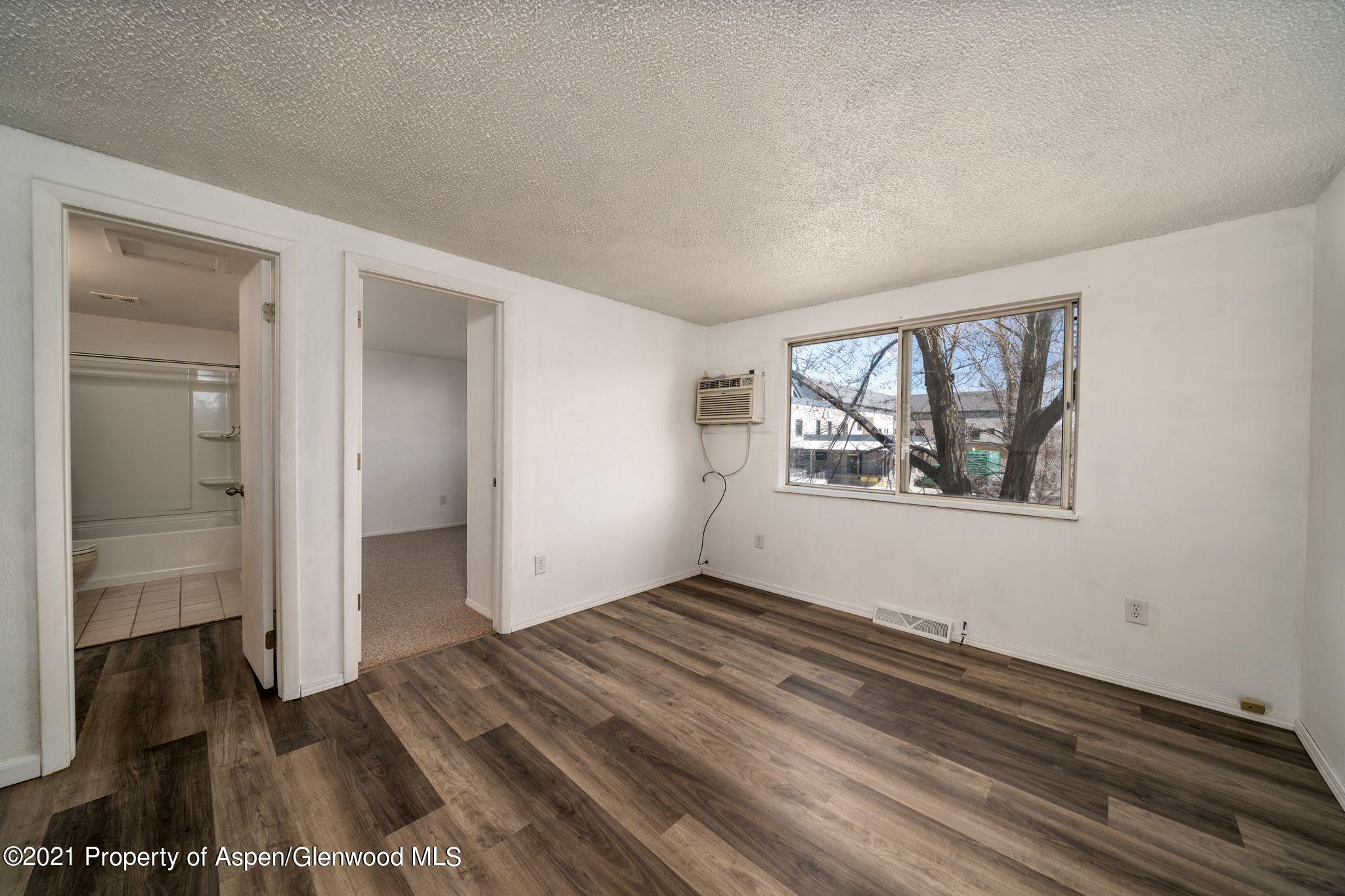 338 Ute Avenue Rifle, CO 81650 - Photo 4 of 14 an empty room with windows