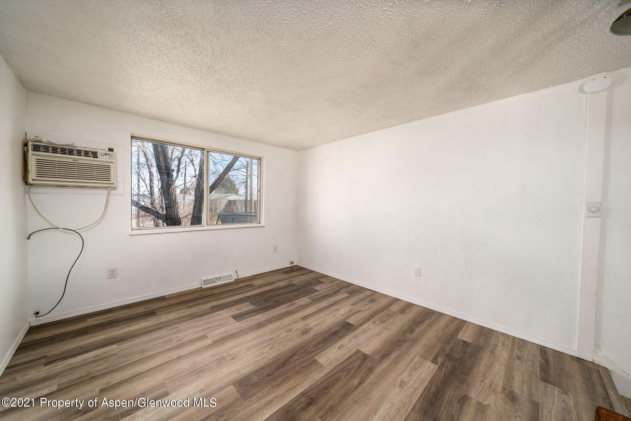 338 Ute Avenue Rifle, CO 81650 - Photo 5 of 14 a view of empty room with window