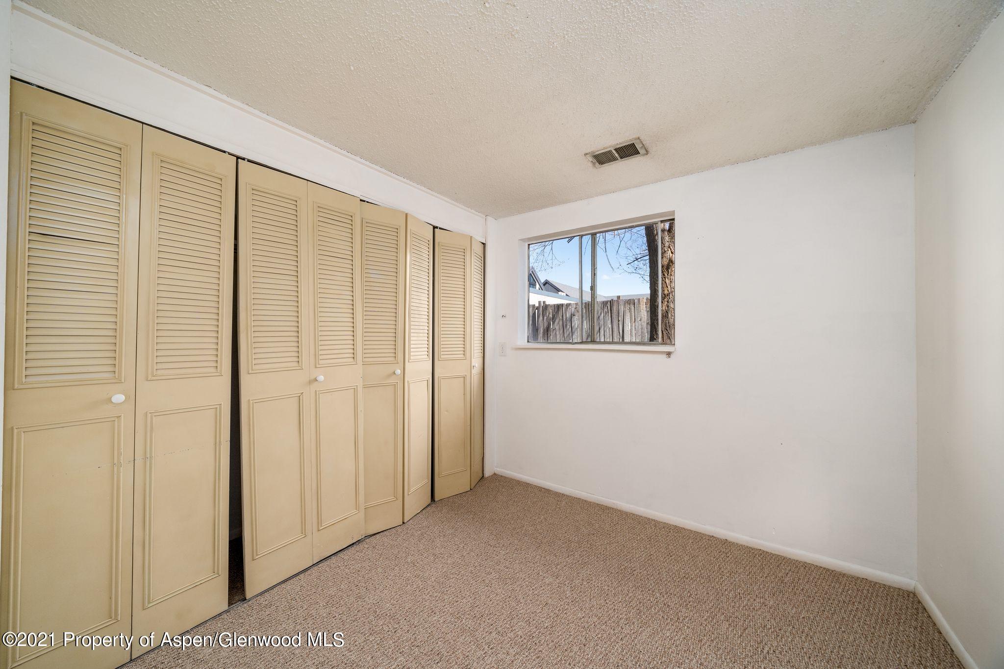 338 Ute Avenue Rifle, CO 81650 - Photo 10 of 14 a view of an empty room with a window