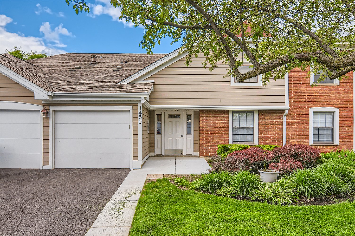1460 7 Pines Road, Unit A1 Schaumburg, IL 60193 - Photo 1 of 11 front view of a house with a yard