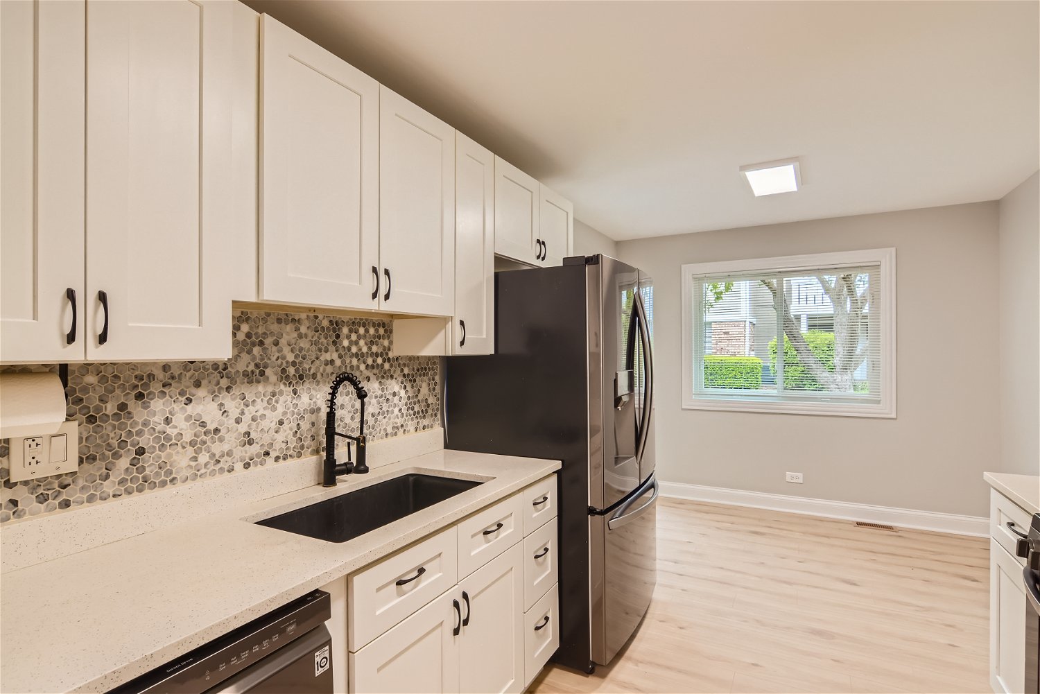 1460 7 Pines Road, Unit A1 Schaumburg, IL 60193 - Photo 4 of 11 a kitchen with a refrigerator and a sink