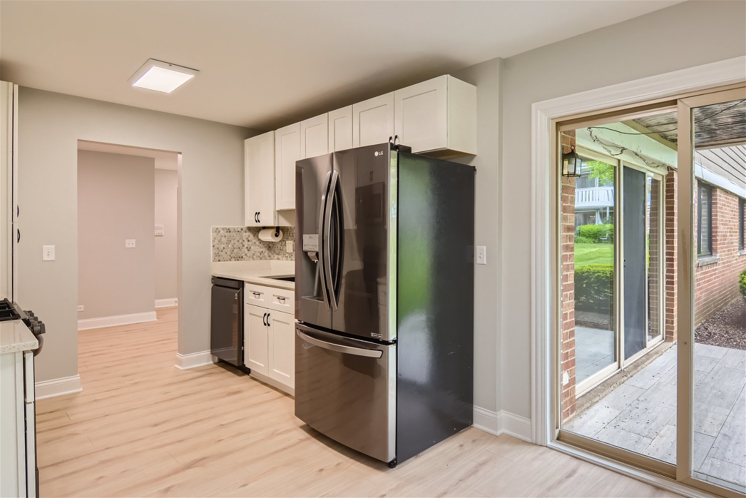 1460 7 Pines Road, Unit A1 Schaumburg, IL 60193 - Photo 5 of 11 a kitchen with stainless steel appliances a refrigerator and a sink