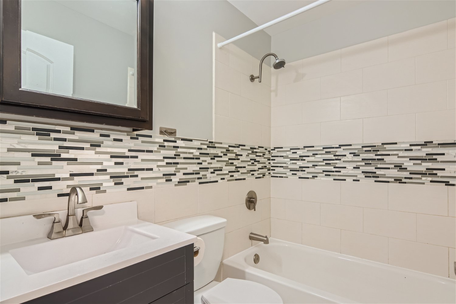 1460 7 Pines Road, Unit A1 Schaumburg, IL 60193 - Photo 8 of 11 a bathroom with a sink and a mirror