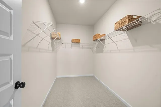 a view of a kitchen from the hallway