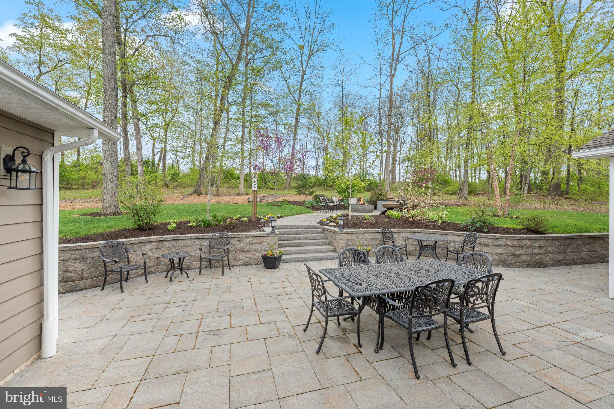 418 Church Road Hatfield, PA 19440 - Photo 34 of 53 Serene patio amidst lush greenery.