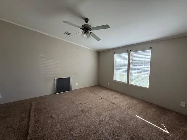 a view of an empty room with a window
