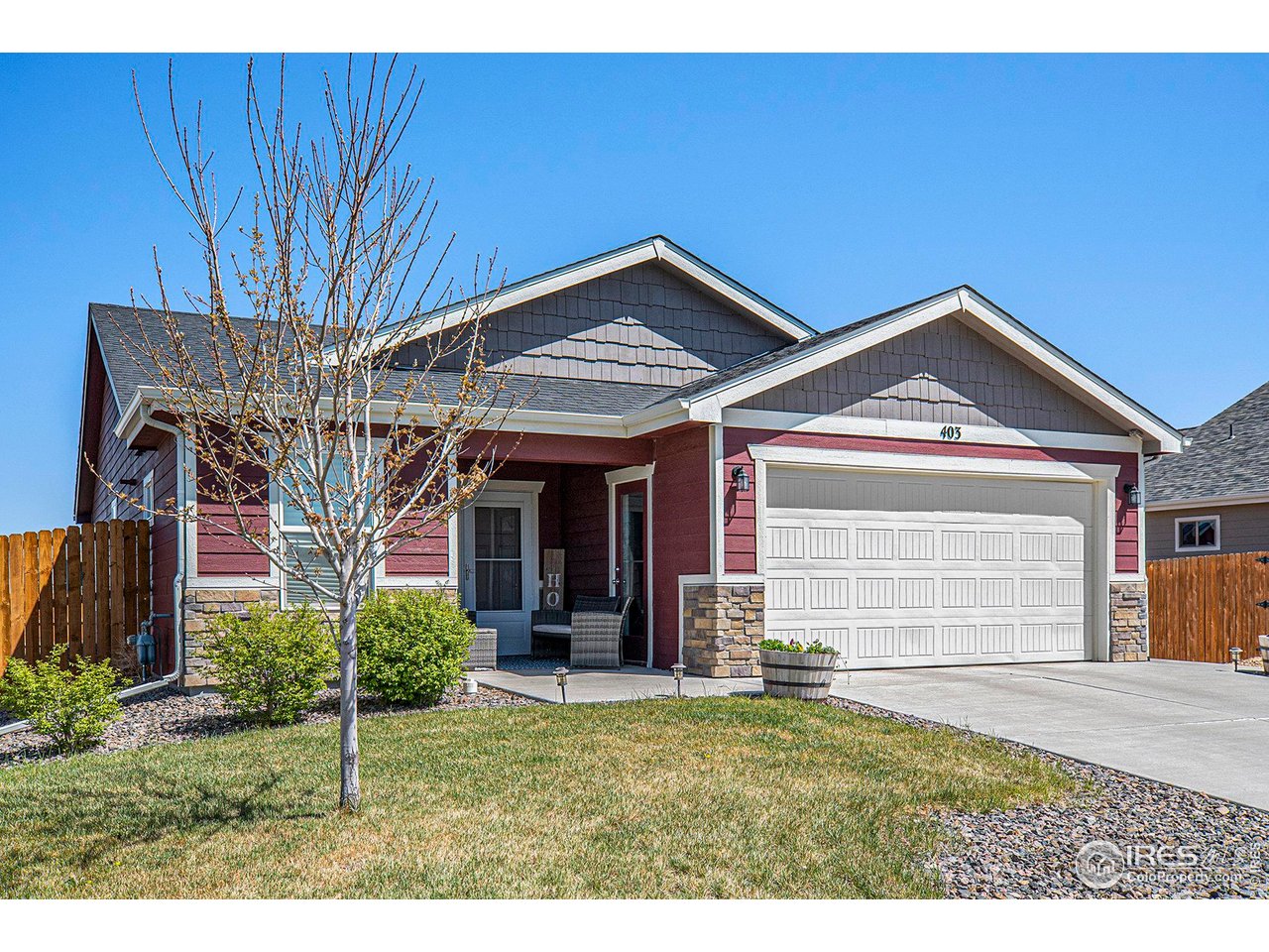 403 11th Avenue Wiggins, CO 80654 - Photo 1 of 13 a view of a house with a yard