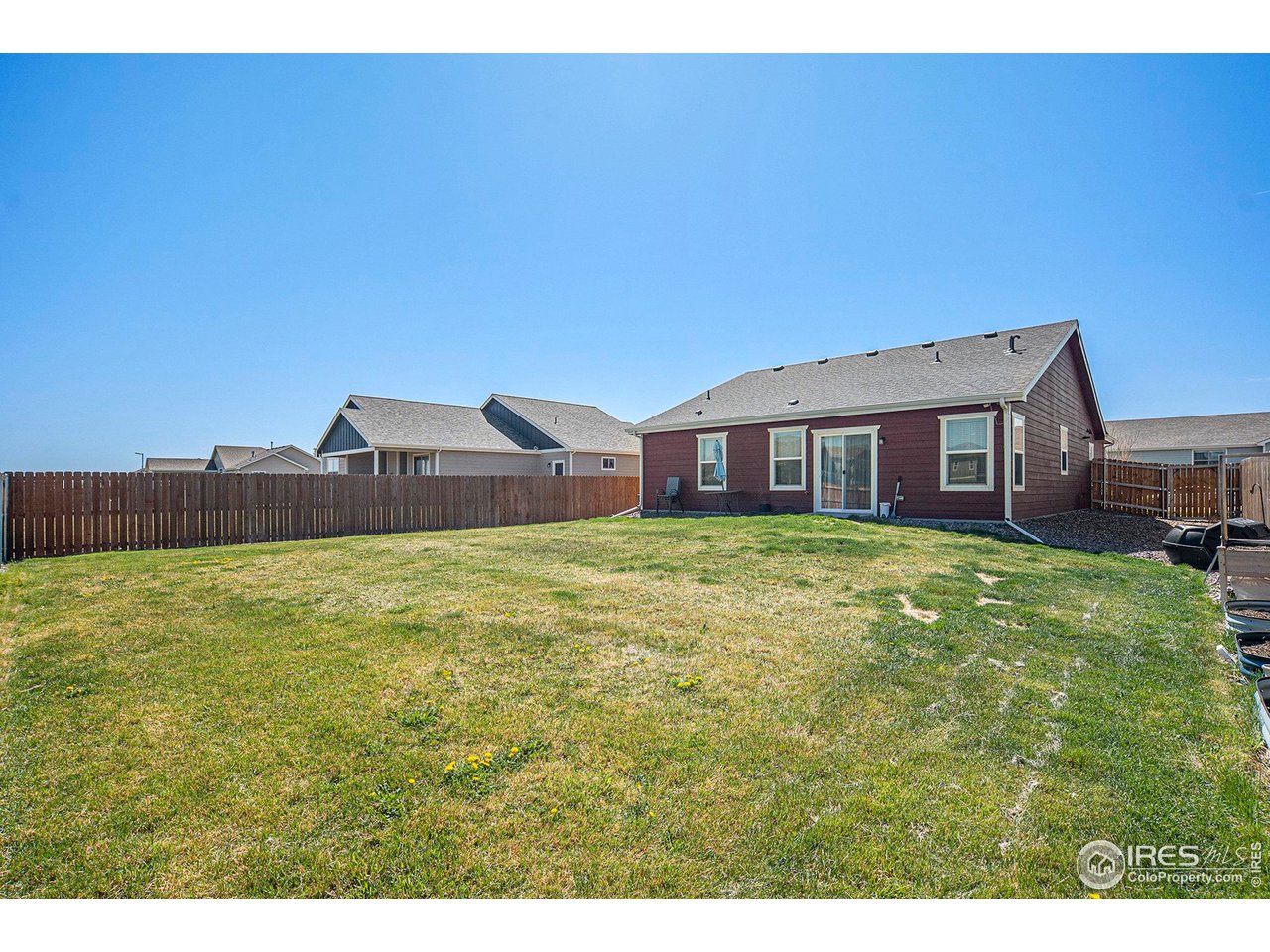 403 11th Avenue Wiggins, CO 80654 - Photo 13 of 13 a house view with a garden space