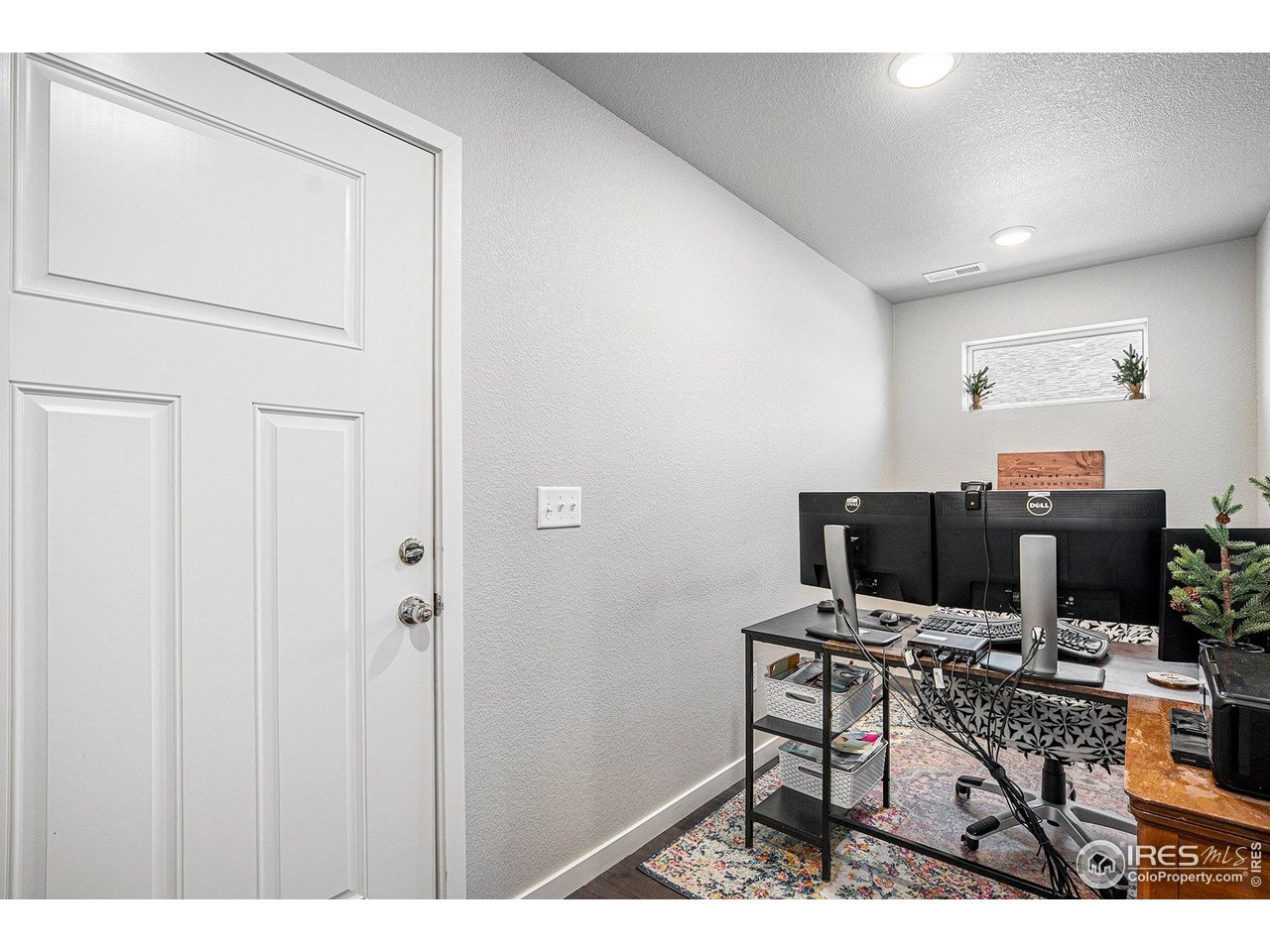 403 11th Avenue Wiggins, CO 80654 - Photo 8 of 13 a workspace with furniture and white walls