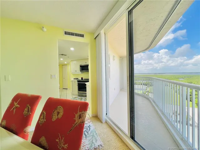 a bed room with a bed and a chair