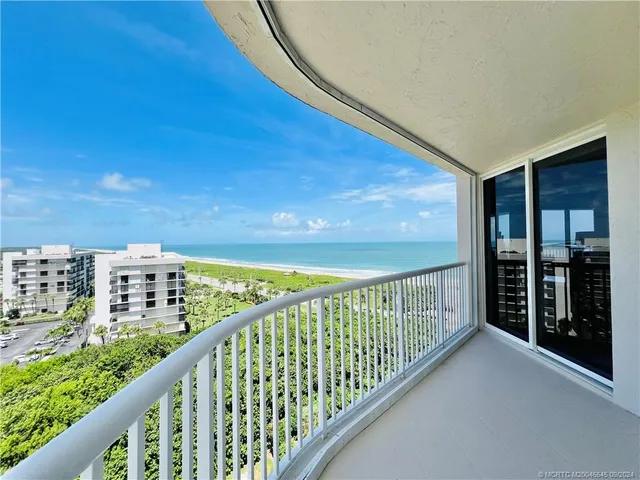 a bed sitting in a bedroom and a flat screen tv