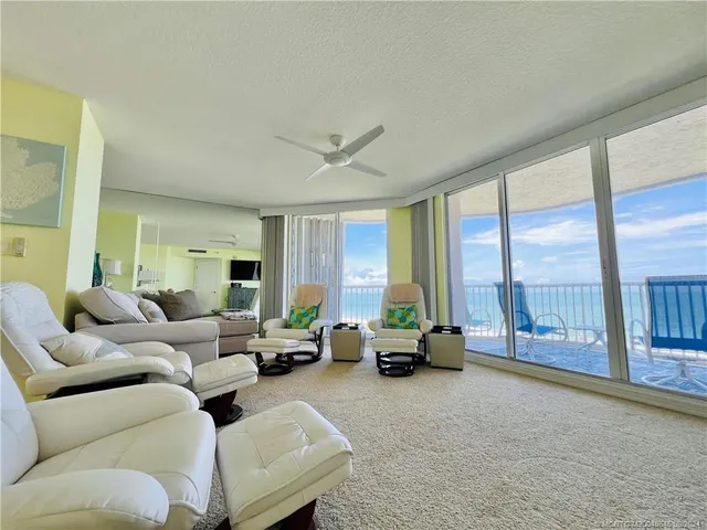 a bedroom with a bed and a flat tv screen on dresser