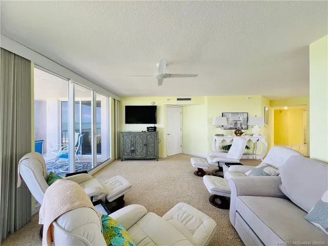 a bedroom with a bed and a lamp next to a window