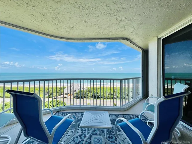 a view of a balcony with wooden floor