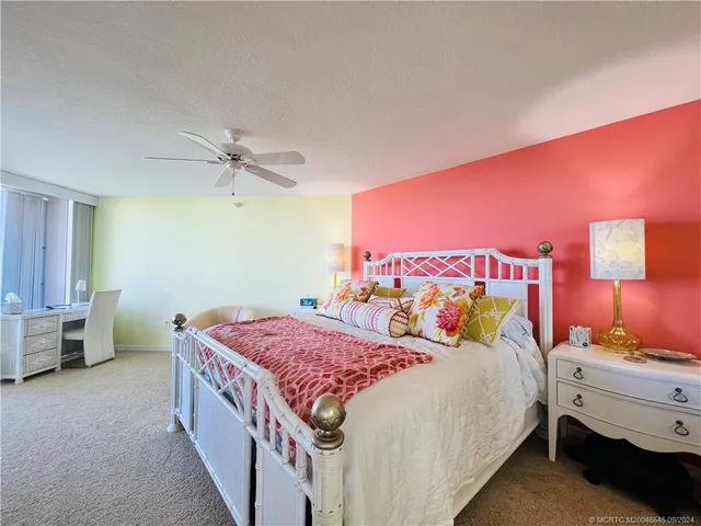 a bed room with a bed and a television