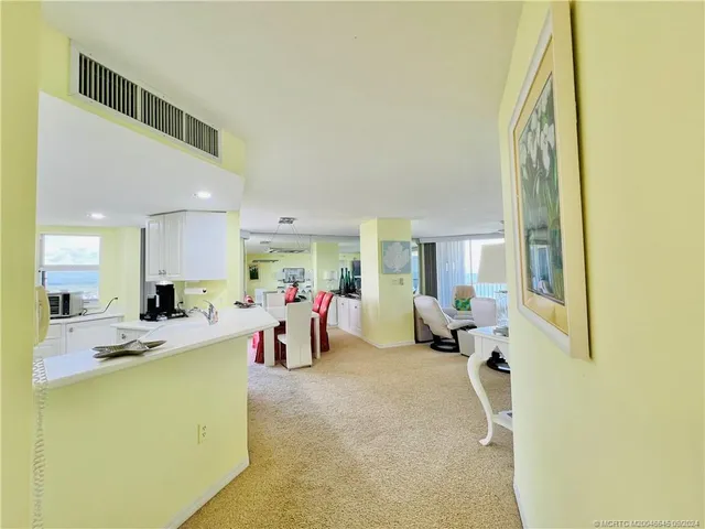 a kitchen with stainless steel appliances a stove microwave sink and refrigerator