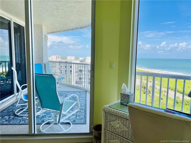 a spacious bathroom with a granite countertop sink and a mirror