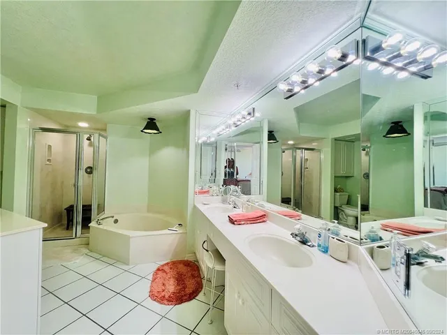 a view of a patio with dining table and chairs with wooden floor