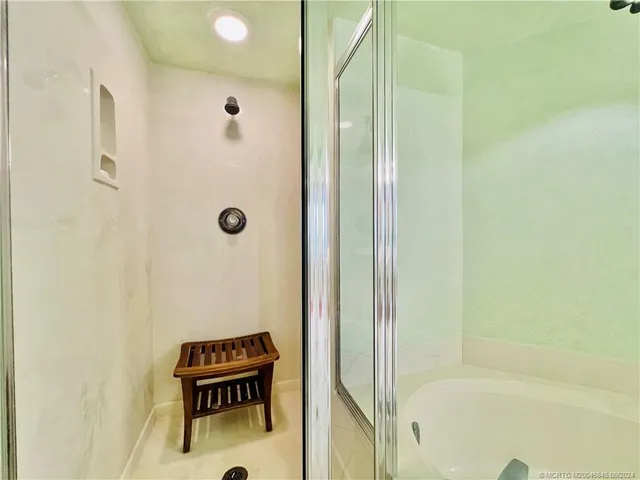 a view of a swimming pool and lounge chair