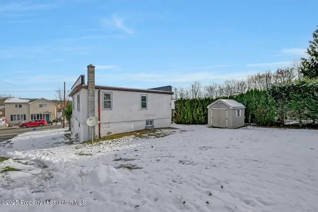 a view of empty room with wooden ceiling