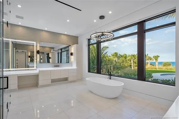 a bathroom with a granite countertop sink a mirror and a