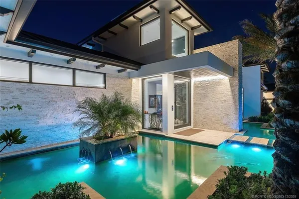 a view of a swimming pool with a patio