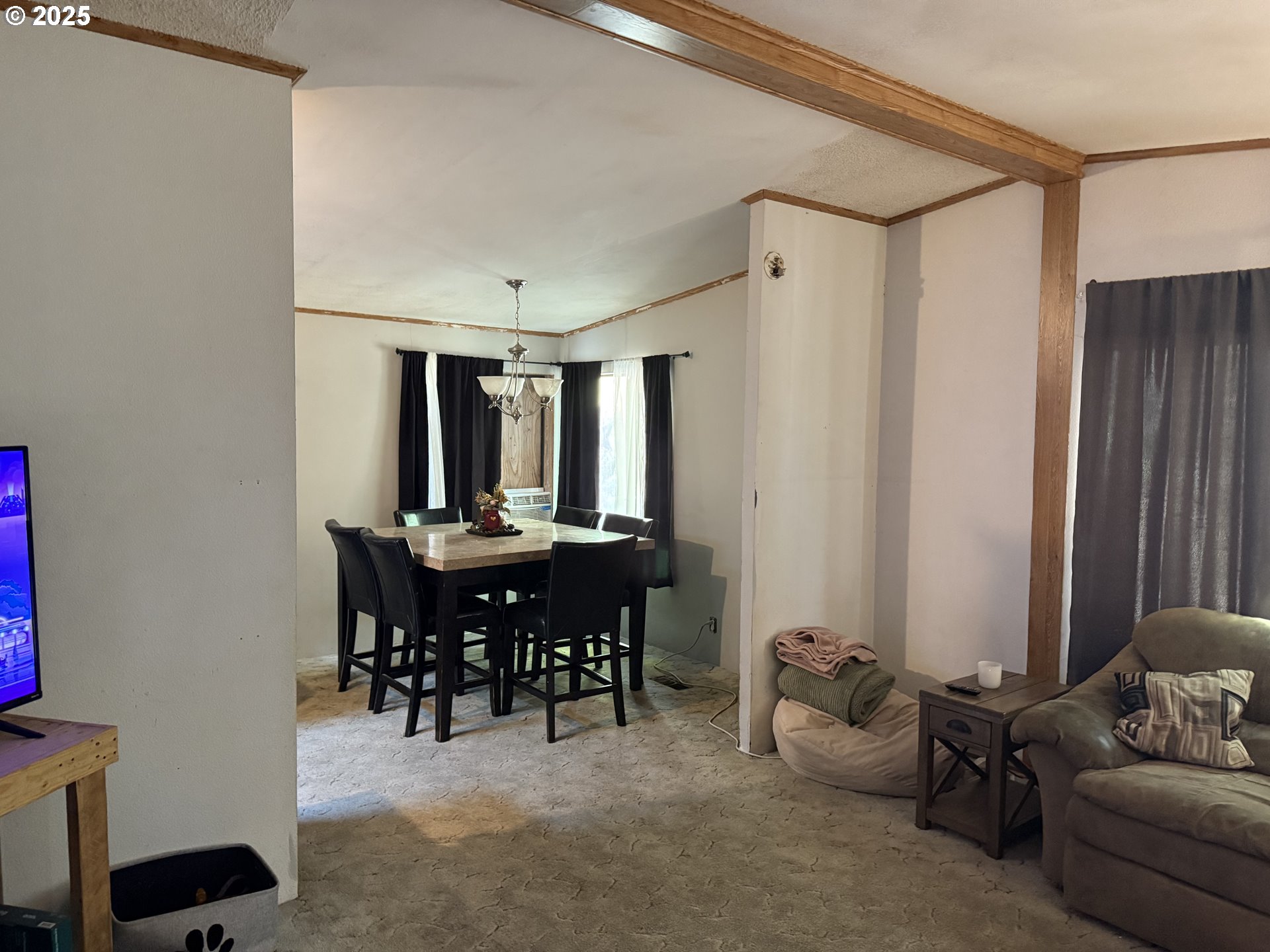 590 Northeast Spring Street White Salmon, WA 98672 - Photo 11 of 13 a view of a livingroom with furniture and window