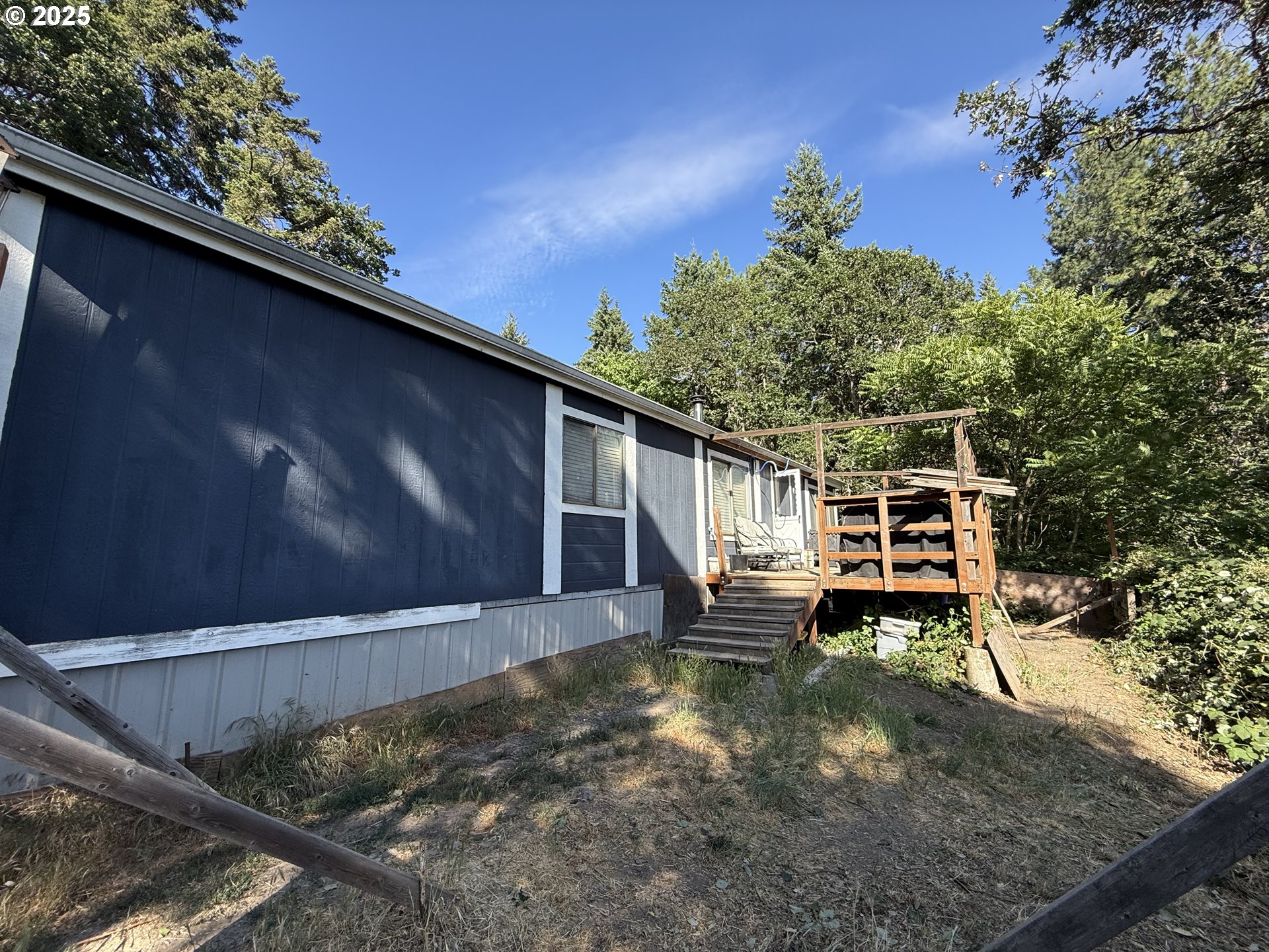 590 Northeast Spring Street White Salmon, WA 98672 - Photo 5 of 13 a backyard of a house with table and chairs