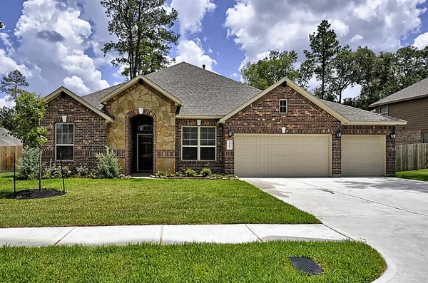 a view of a house with a big yard