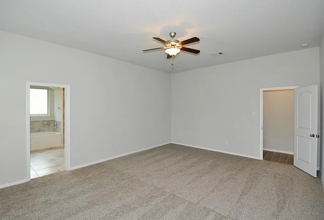 a kitchen with stainless steel appliances granite countertop a sink a stove and microwave