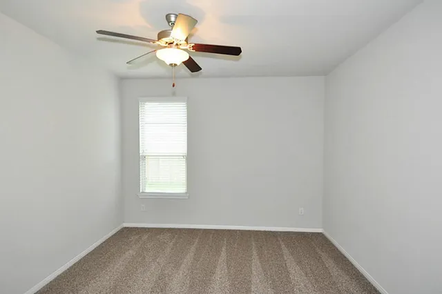 a spacious bathroom with a granite countertop tub sink and mirror