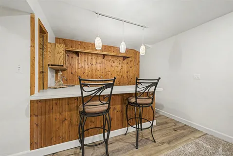 a view of a chairs and table in the front of a house