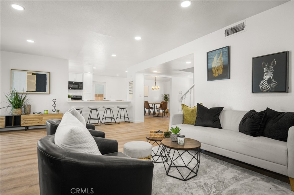 19212 Gunlock Avenue Carson, CA 90746 - Photo 11 of 56 a living room with furniture and a couch