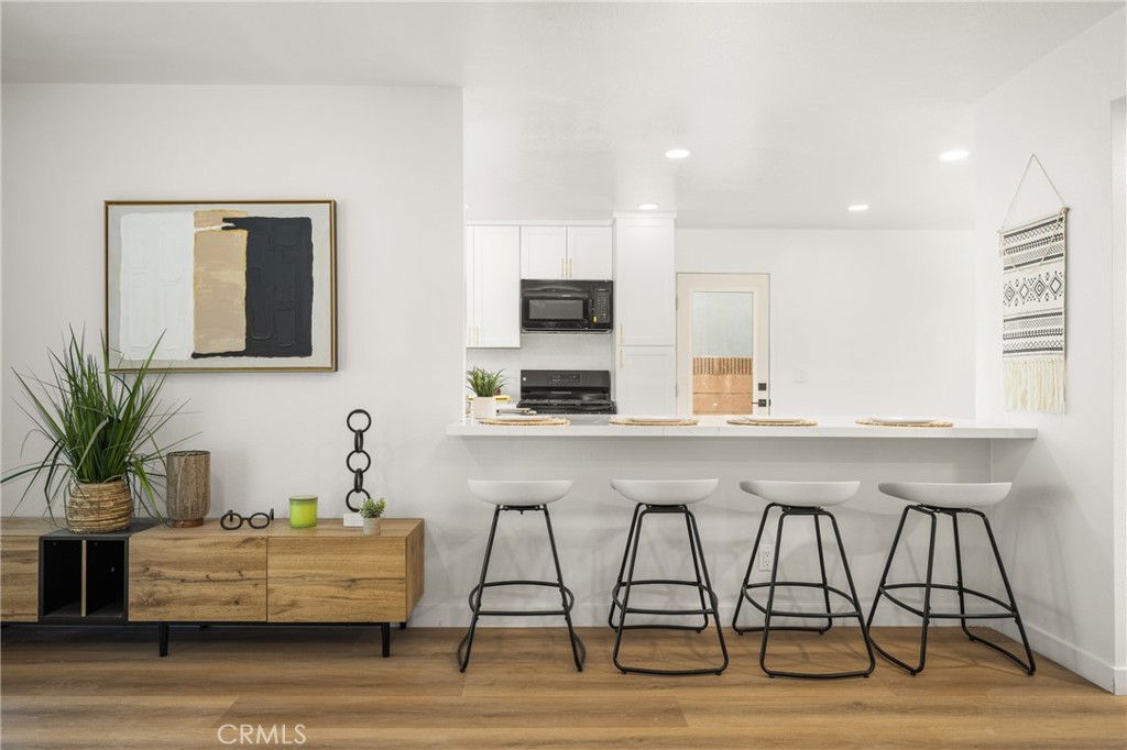 19212 Gunlock Avenue Carson, CA 90746 - Photo 12 of 56 a living room with furniture and a flat screen tv