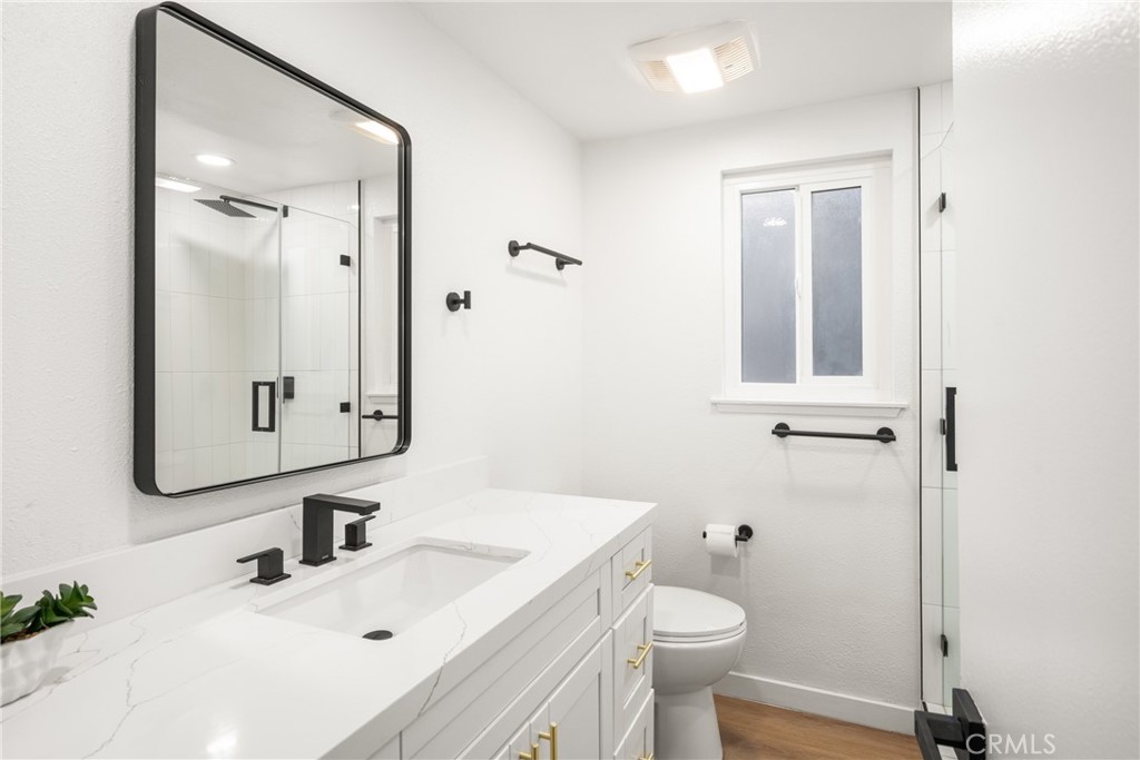 19212 Gunlock Avenue Carson, CA 90746 - Photo 34 of 56 a bathroom with a sink toilet and mirror
