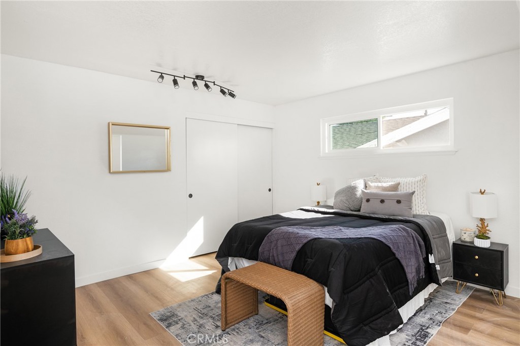 19212 Gunlock Avenue Carson, CA 90746 - Photo 55 of 56 a bedroom with a bed and wooden floor