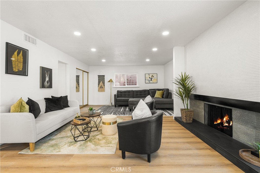 19212 Gunlock Avenue Carson, CA 90746 - Photo 7 of 56 a living room with furniture and a fireplace