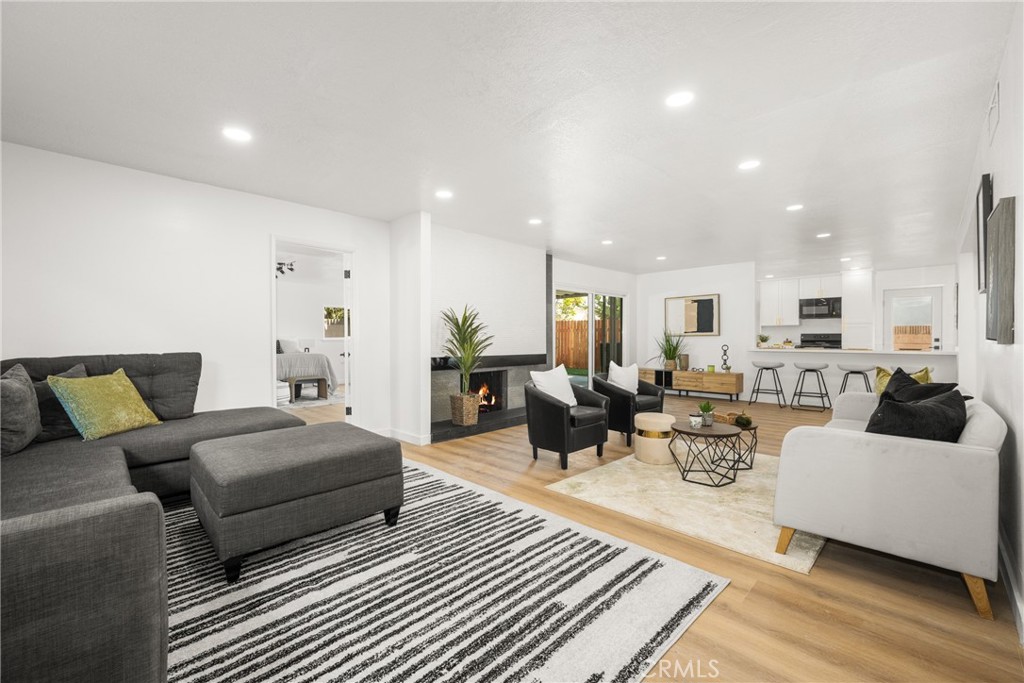 19212 Gunlock Avenue Carson, CA 90746 - Photo 9 of 56 a living room with furniture and view of kitchen