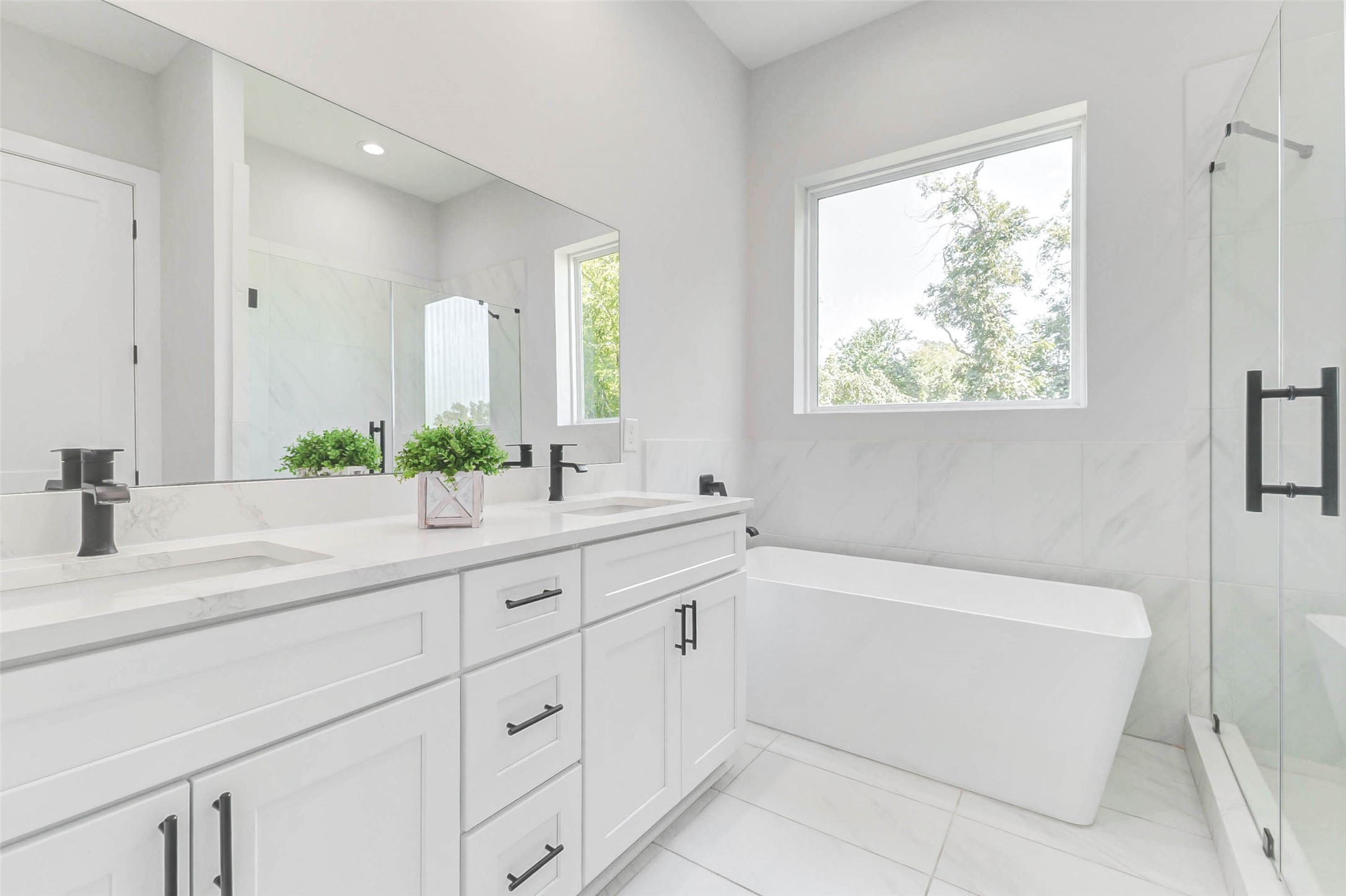 2310 Campbell Road, Unit C Houston, TX 77080 - Photo 11 of 27 a bathroom with a bathtub a sink and a window
