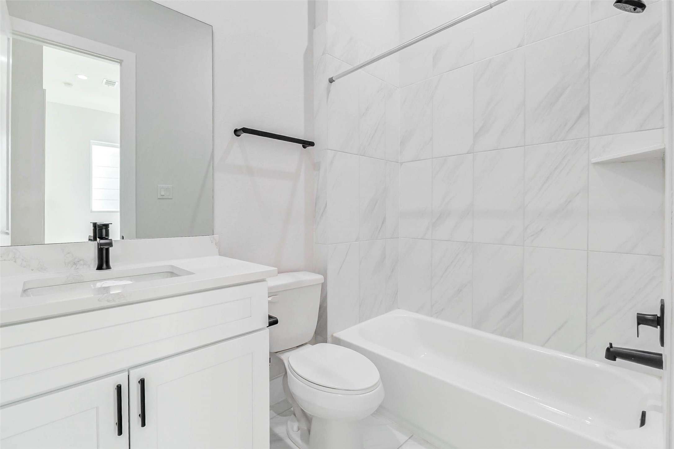 2310 Campbell Road, Unit C Houston, TX 77080 - Photo 20 of 27 a bathroom with a sink a toilet and a bathtub