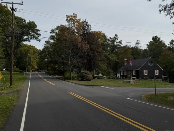 a view of a house with a street