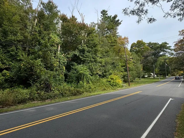 a view of a city street from a balcony
